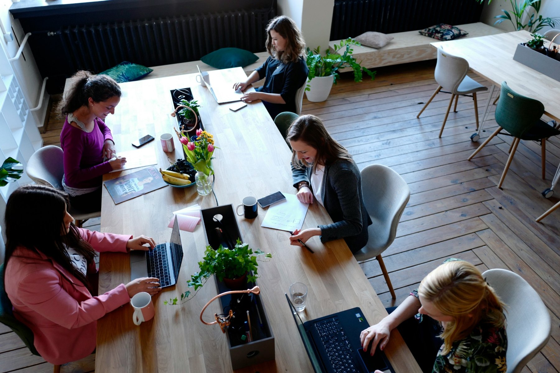 Colleagues working around a shared table